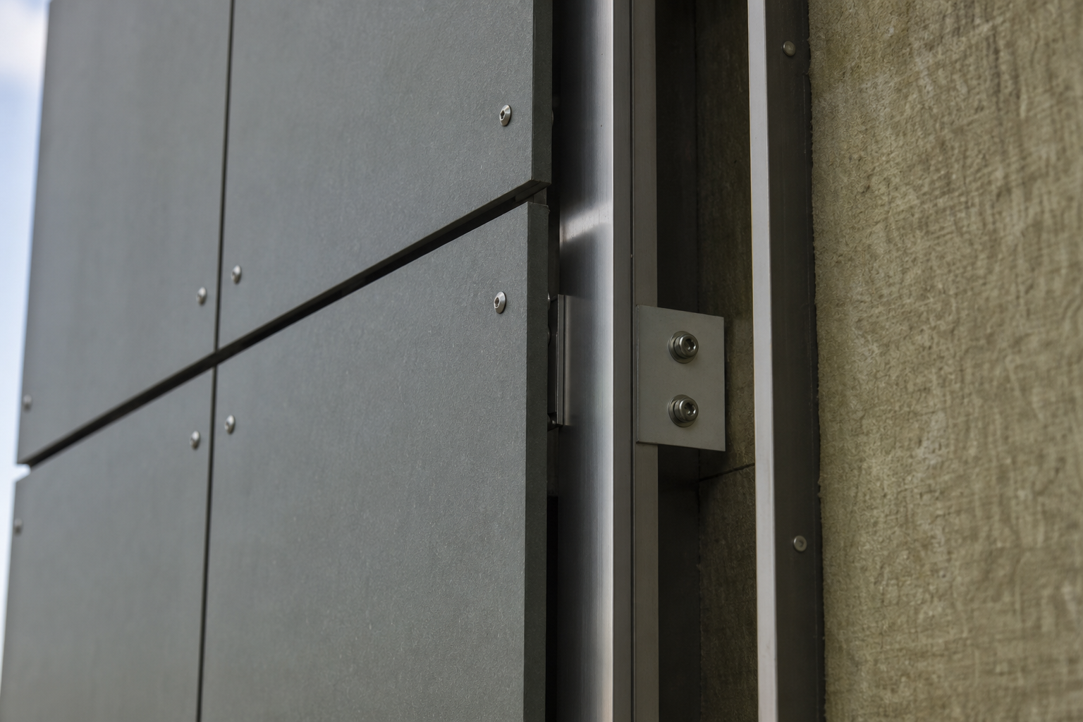 Fibre-cement cladding panels on ventilated subframe