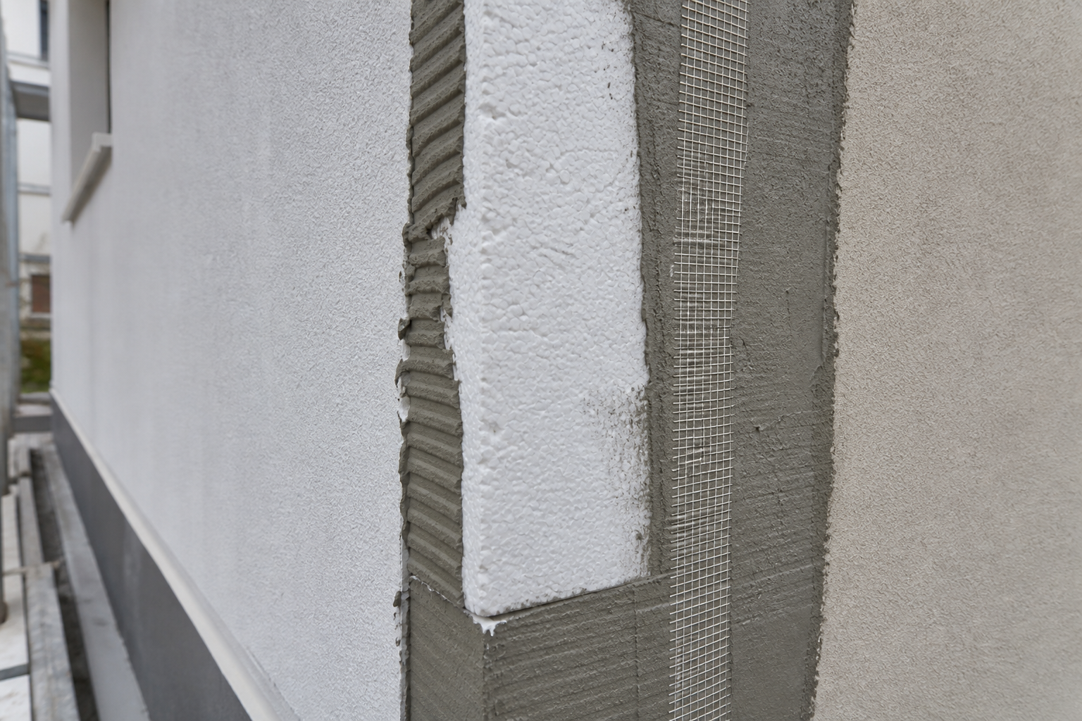 Close-up of ETICS insulation layers on building corner