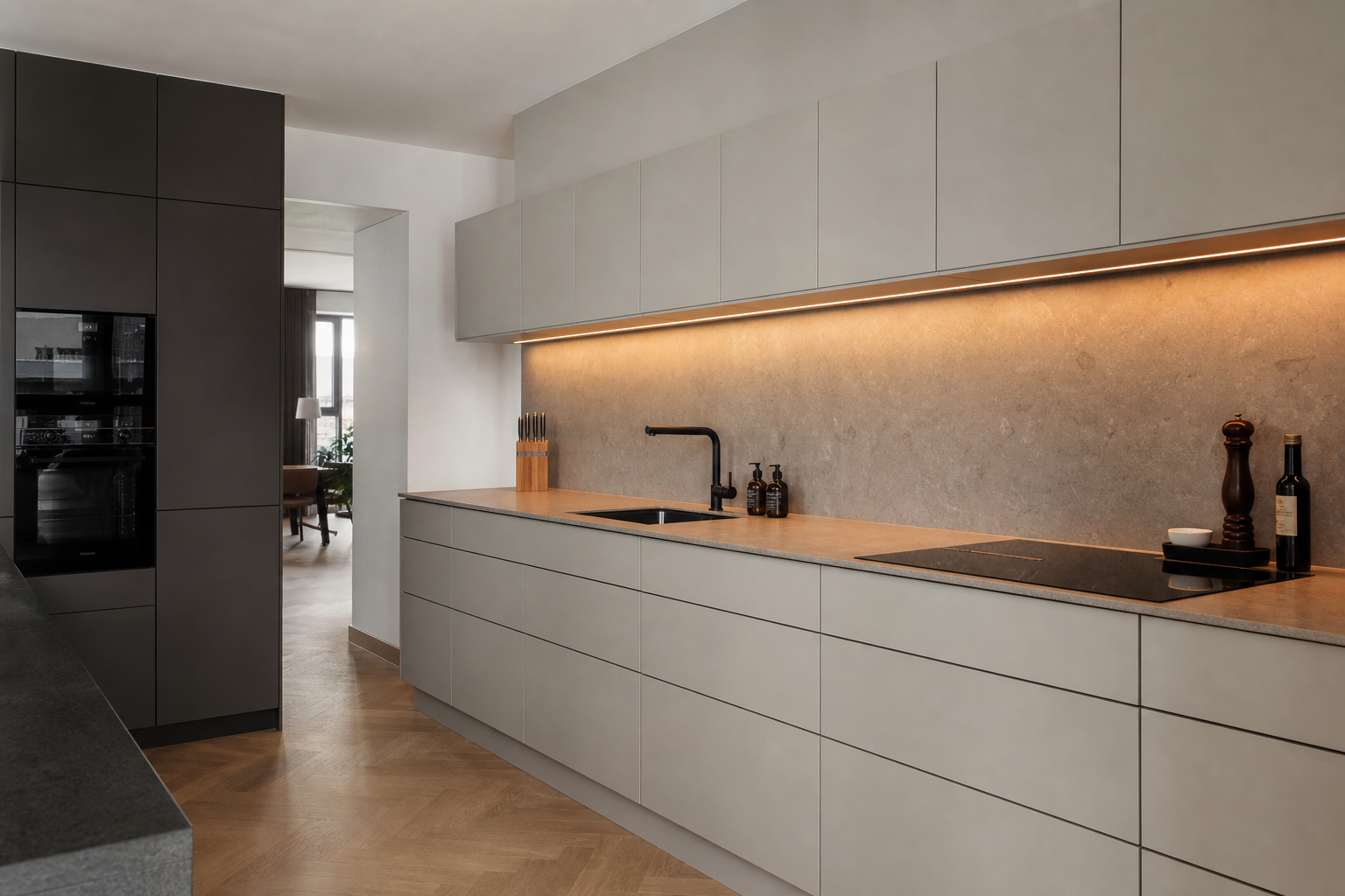 Handleless kitchen with stone countertop and integrated lighting